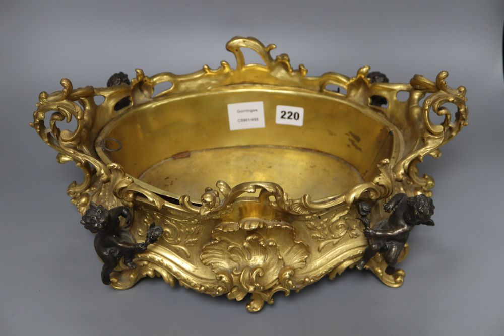 A Victorian style ormolu centrepiece, mounted with cherubs, length 43cm